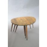 ERCOL NEST OF TABLES a set of 3 'Pebble' dark elm graduated occasional tables. Largest table 65cms