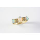 AN OPAL AND DIAMOND RING the three oval-shaped solid white opals are set with four circular-cut