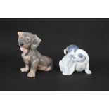 ROYAL COPENHAGEN DOGS including Model No 856 Large Dachshund Puppy, and No 260 Pointer Puppies. Both