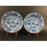 PAIR OF CHINESE KRAAK STYLE DISHES possibly late Ming, painted with figures by a pagoda inside a