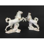 TWO MEISSEN HORSES ON CLOUDS circa 1750, both rearing and wearing gilt harnesses, from a chariot