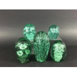 FOUR GREEN GLASS DUMPS possibly Kilner, each with pots of flowers, 12.5cm to 8cm; together with