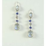 A PAIR OF MOONSTONE, DIAMOND AND SAPPHIRE DROP EARRINGS each earring set with two oval cabochon