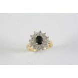 A SAPPHIRE AND DIAMOND CLUSTER RING the oval-shaped sapphire is set within a surround of circular-