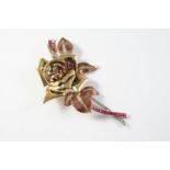 A GOLD, RUBY AND DIAMOND FOLIATE SPRAY BROOCH the gold foliate mount is set with circular-cut rubies