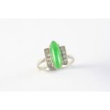 AN ART DECO JADE AND DIAMOND RING the lozenge-shaped jade is millegrain set with four single-cut
