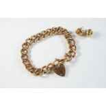 A 9CT GOLD CURB LINK BRACELET with padlock clasp, each link stamped 9ct, 18.5cm long, 18.9 grams,