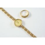 A LADY'S 9CT GOLD WRISTWATCH BY ROTARY the signed circular dial with baton numerals, on a 9ct gold