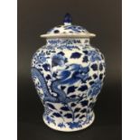 CHINESE BLUE AND WHITE VASE AND COVER of baluster form, painted with scrolling dragons amongst