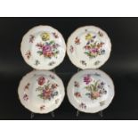 SET OF FOUR MEISSEN PLATES late 19th century, outside painted with deutsche blumen, cancelled blue