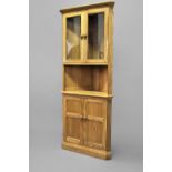 MODERN ERCOL CORNER CABINET a large light elm corner cabinet, with a glazed top section and carved