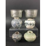 COLLECTION OF FOUR EARLY CHINESE STYLE VASES of squat ovoid form, three with blue painted decoration