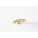 A DIAMOND FIVE STONE RING the five graduated cushion-shaped diamonds are set in 18ct gold,