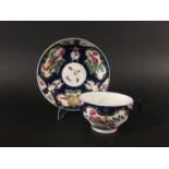 WORCESTER BLUE SCALE TEACUP AND SAUCER circa 1770, gilt mirror shaped cartouches painted with