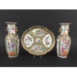 PAIR OF CHINESE CANTON STYLE VASES Guangxu, enamelled with figural cartouches on a floral and