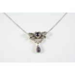 AN EARLY 20TH CENTURY AMETHYST AND DIAMOND PENDANT centred with a heart-shaped amethyst within a