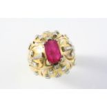 A RUBY AND DIAMOND RING the rectangular-shaped ruby is set within an 18ct gold mount set with