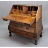 DUTCH OAK BOMBÉ BUREAU, 19th century, the fall front enclosing a fitted interior above