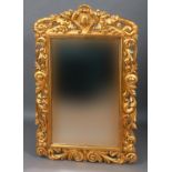 GILTWOOD MIRROR the bevelled rectangular plate inside a scrolling frame centred on a crest, height