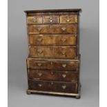 WALNUT CHEST ON CHEST 18th century, with three short above three long drawers, the base with three