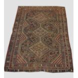 KHAMESH RUG, SOUTH WEST IRAN the midnight blue field of tribal devices and stylised chickens