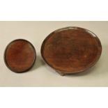 GEORGE III MAHOGANY CIRCULAR TRAY on four white metal, shell feet, diameter 25cm; together with a