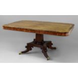 REGENCY MAHOGANY AND ROSEWOOD CROSSBANDED BREAKFAST TABLE the rounded rectangular top on a