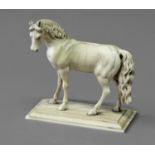 IVORY STUDY OF A HORSE probably Dieppe, standing looking to the left, on a rectangular base,