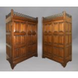 PAIR OF CONTINENTAL GOTHIC, OAK WARDROBES later 19th century, the pierced gallery above a pair of