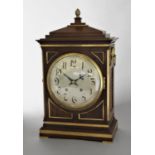 REGENCY STYLE MAHOGANY AND BRASS MOUNTED BRACKET CLOCK the 7 1/2" silvered dial on a brass, eight