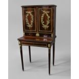 LOUIS XVI STYLE BONHEUR DU JOUR mahogany, the pair of cupboard doors applied with ormolu wreaths