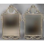 PAIR OF FRENCH WALL MIRRORS the central rectangular plate beneath an oval plate, the frame with