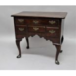 GEORGE III MAHOGANY LOWBOY mid 18th century, the moulded, rectangular top above one long and three