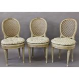 SET OF EIGHT LOUIS XV STYLE PAINTED SALON CHAIRS stamped Loidrault/Paris, the caned back with