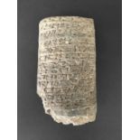 MESOPOTAMIAN ANTIQUITIES: A fragmentary foundation cone, with the cone head and a small part of