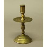 DUTCH BRASS HEEMSKERK CANDLESTICK 17th century, the turned sconce above a dish drip tray, baluster