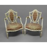 PAIR OF FRENCH, PAINTED FAUTEUILS the shield shaped back above a serpentine seat, with carved,
