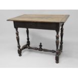 ITALIAN WALNUT SIDE TABLE probably 17th century, the cleated top above a single drawer, on faceted