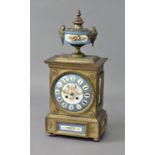 FRENCH GILT METAL AND PORCELAIN MOUNTED MANTEL CLOCK the 5 1/4" porcelain dial painted with