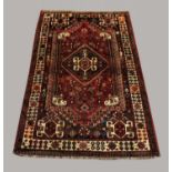KASHGAI RUG South West Iran, 20th century, the strawberry field centred by a diamond medallion the