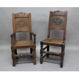 SET OF SIX OAK CAROLEAN STYLE BACK STOOLS with a shaped top rail, carved back rest, panel seat,