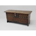 OAK SIX PLANK COFFER late 16th century, the cover with notched decoration to the ends, the front