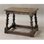 CAROLOEAN STYLE OAK JOINT STOOL the rectangular top above a carved frieze, knop turned legs and