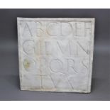 PLASTER PANEL OF AN ALPHABET 20th century, with four rows of letters, 59cm x 58cm