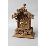 BLACK FOREST CUCKOO CLOCK late 19th century, the 5 1/2" dial with Roman numerals on a brass, eight