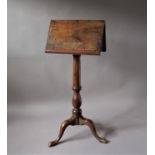 OAK TWO SIDED LECTURN OR MUSIC STAND 19th century, on a turned, baluster column and tripod base,