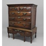 OAK CHEST ON STAND 18th century, the chest with two short and three long drawers with a raised