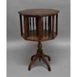OAK REVOLVING BOOKCASE circa 1900, the octagonal body with turned spindle supports on a