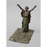 COLD PAINTED BRONZE OF AN ARAB AT PRAYER Bergman, he standing with his arms raised on a Persian rug,