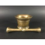 BRONZE MORTAR AND PESTLE probably 17th century, with banded decoration, diameter 12cm, length of